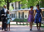 U.S. President Barack Obama (L) and first lady Michelle Obama (R) walk with their daughters Sasha (2L) and Malia (2R) through Lafayette Square from St. John's Protestant Episcopal Church to the White House July 17, 2011 in Washington, DC. The First Family attended Sunday services.(Photo by Brendan Smialowski-Pool/Getty Images)