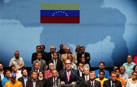 Julio Borges (C), President of the National Assembly and deputy of the Venezuelan coalition of opposition parties (MUD), talks during a meeting of the Venezuelan coalition of opposition parties (MUD) in Caracas, Venezuela July 3, 2017. REUTERS/Carlos Garcia Rawlins