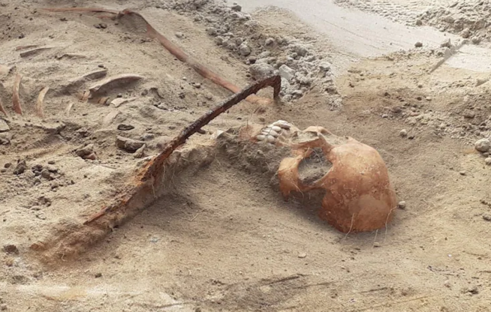 Remains of a female “vampire” with a sickle across her throat seen after they were unearthed at an archaeological site in a 17th-century cemetery in Bydgoszcz, Poland in August 2022.