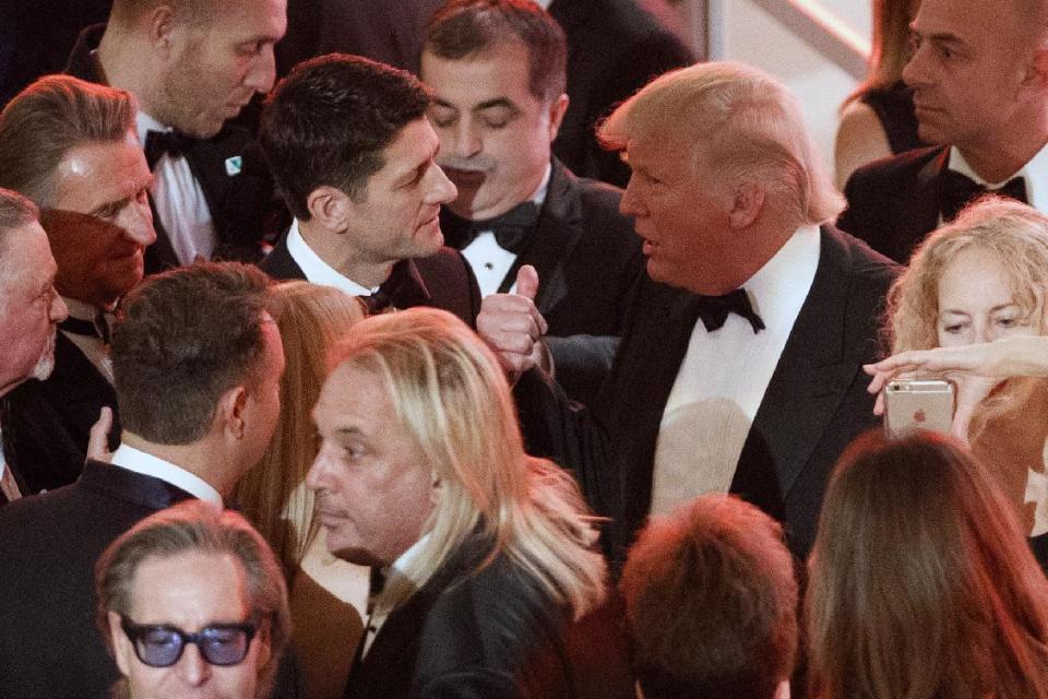 President-elect Donald Trump talks with Speaker of the House Rep. Paul Ryan, R-Wis., during a VIP reception and dinner with donors, Thursday, Jan. 19, 2017, in Washington. (AP Photo/Evan Vucci)