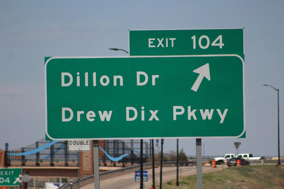 A sign of the Dillon Drive and Drew Dix Parkway northbound exit on Interstate 25 in Pueblo.