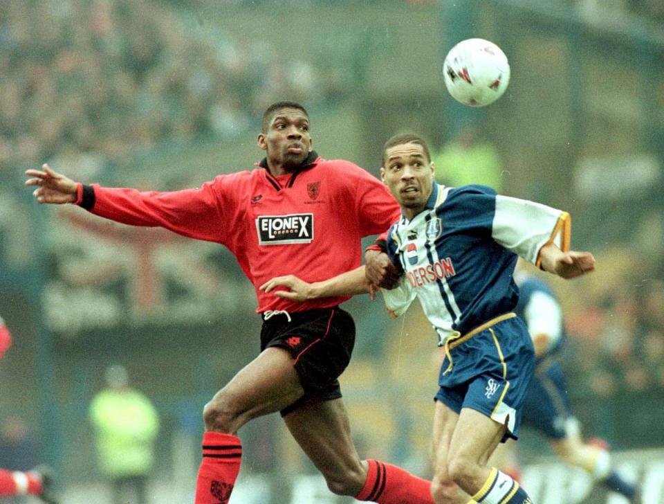 Wimbledon's Efan Ekoku and Sheffield Wednesday's Des Walker in action at Hillsborough in the 1990s (PA)