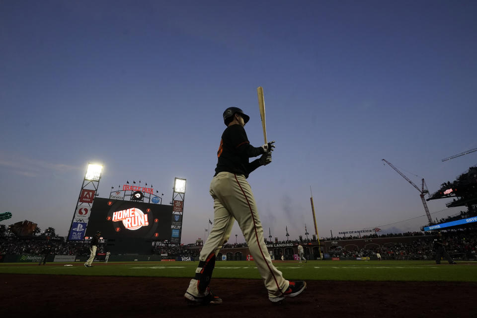 San Francisco Giants' Buster Posey walks to the on-deck circle during the sixth inning of a baseball game against the Pittsburgh Pirates in San Francisco, Saturday, July 24, 2021. (AP Photo/Jeff Chiu)