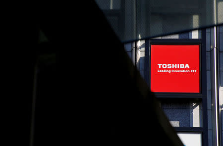 FILE PHOTO: A logo of Toshiba Corp is seen outside an electronics retail store in Tokyo, Japan, February 14, 2017. REUTERS/Toru Hanai/File Photo