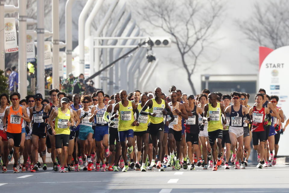 Elite runners start their race at the Tokyo Marathon in Tokyo, Sunday, March 1, 2020. Organizers of the Tokyo Marathon reduced the number of participants out of fear of the spread of the coronavirus from China. The general public was essentially barred from the race. (AP Photo/Shuji Kajiyama)