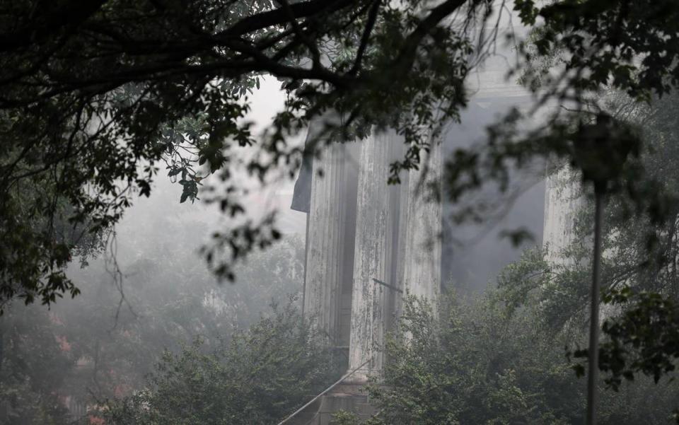 Firefighters work to extinguish a massive fire in the historic Babcock building on the BullStreet Campus.