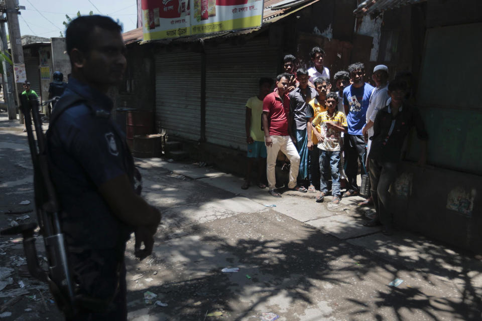 <p>Bangladeshis gather near a shooting scene in Narayanganj, outskirts of Dhaka, Saturday, Aug. 27, 2016. (AP Photo) </p>