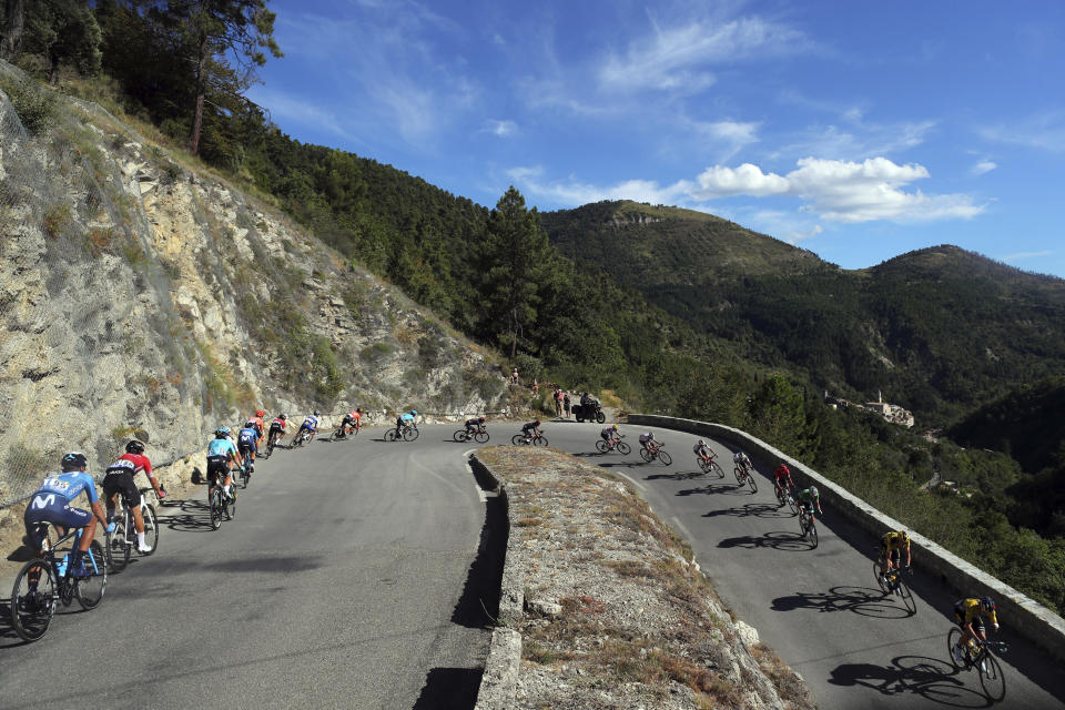 The pack speeds down Turini pass during the second stage of the Tour de France cycling race over 186 kilometers (115,6 miles) with start and finish in Nice, southern France, Sunday, Aug. 30, 2020. (AP Photo/Thibault Camus)