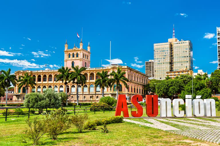 The welcome sign and Palace of the Lopez in Asuncion, Paraguay