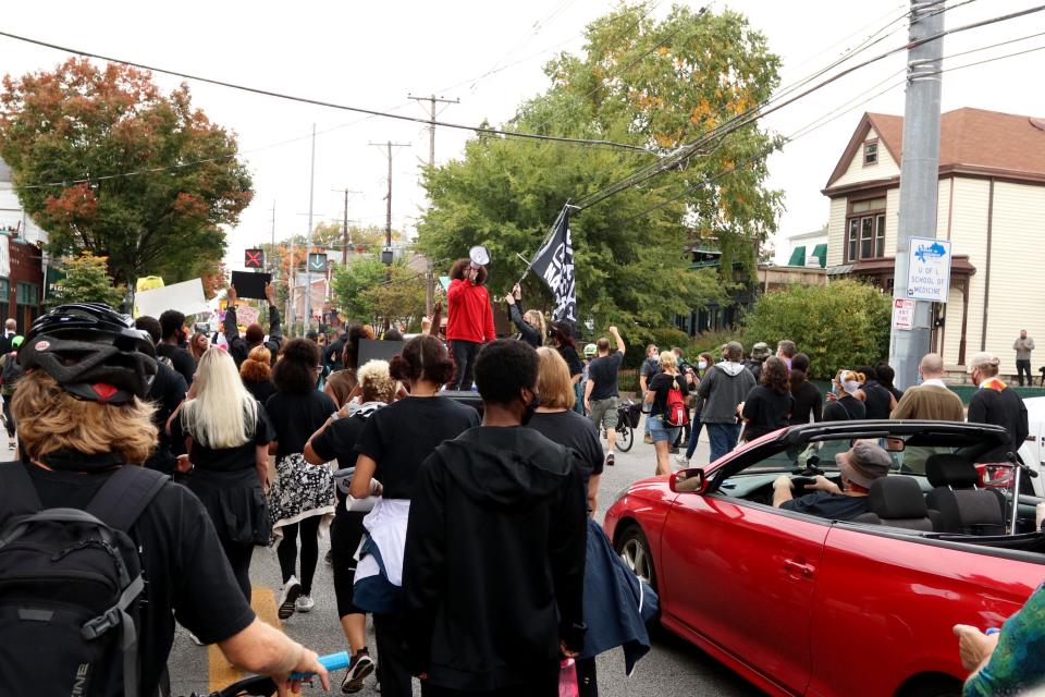 Travis Nagdy, center, leads chants during a march through Louisville in honor of Breonna Taylor. Oct. 10, 2020