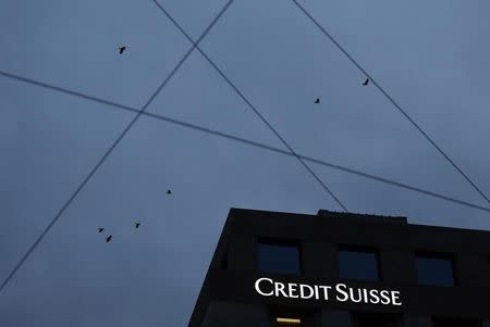 A Credit Suisse sign is pictured on a building of the bank in Geneva November 26, 2014. REUTERS/Denis Balibouse