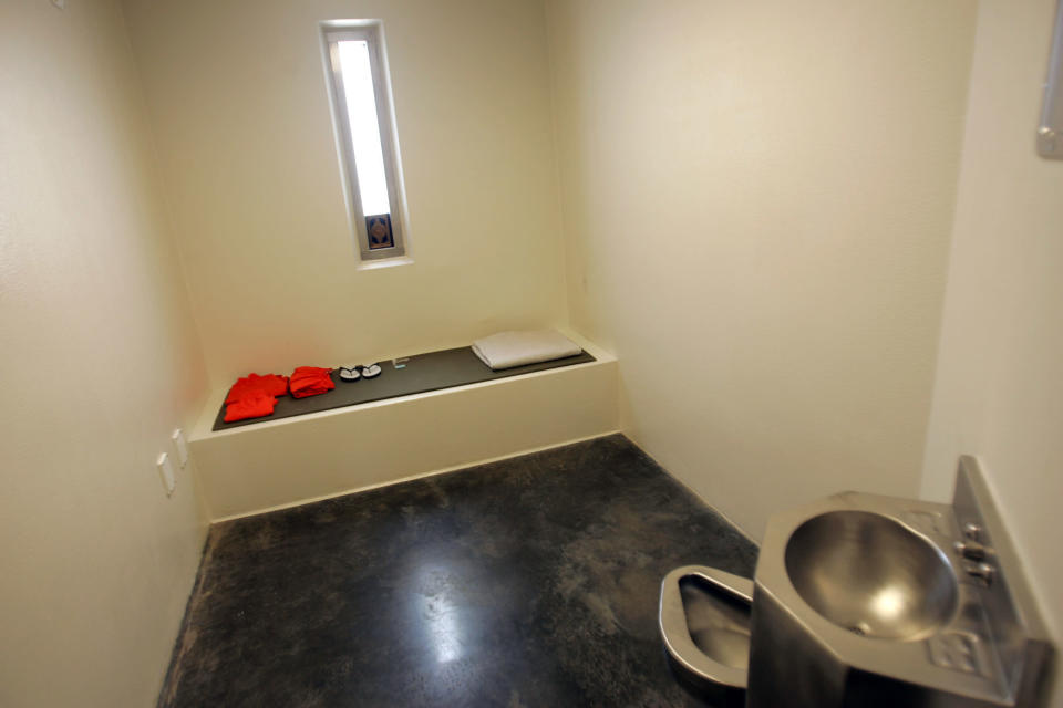 In this photo reviewed by U.S. military officials, a cell for a noncompliant detainee is pictured inside the maximum security prison at Camp 5 in the Guantanamo Bay U.S. Naval Base June 26, 2006. As the Bush administration awaits a ruling on the legitimacy of its Guantanamo war crimes tribunals, the U.S. State Department's top legal advisor said on Monday that emptying the detention camp posed "a real conundrum." REUTERS/Brennan Linsley/Pool (CUBA)