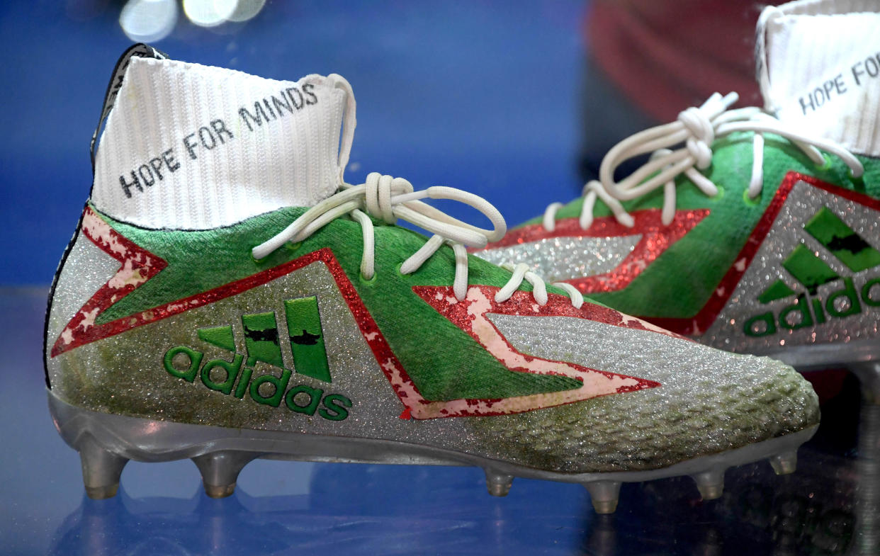Jan 31, 2019; Atlanta, GA, USA; The personalized Adidas cleats of Kansas City Chiefs quarterback Patrick Mahomes (not pictured) on display at the My Cause, My Cleats exhibit at the Super Bowl LIII Experience at the Georgia World Congress Center. Mandatory Credit: Kirby Lee-USA TODAY Sports