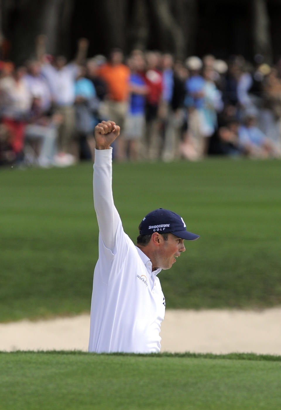 Matt Kuchar celebrates after sinking a birdie putt from the bunker on the 18th green to win the final round of the RBC Heritage golf tournament in Hilton Head Island, S.C., Sunday, April 20, 2014. Kuchar won the tournament with 11-under par. (AP Photo/Stephen B. Morton)