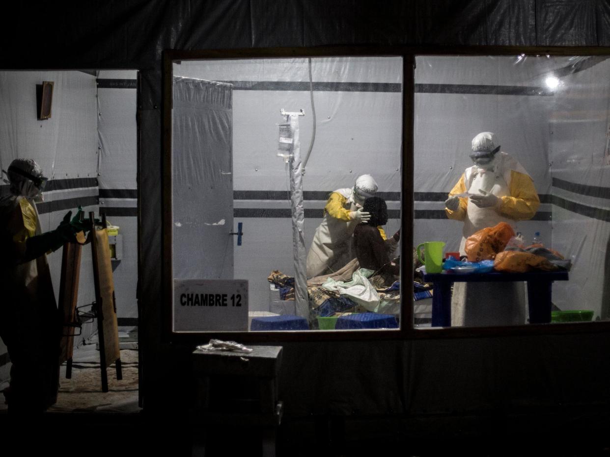 Health workers treat an unconfirmed Ebola patient, inside a treatment centre on November 3, 2018 in Butembo, Democratic Republic of the Congo: JOHN WESSELS/AFP/Getty Images