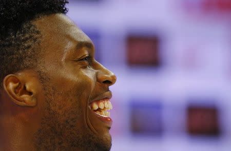 England's Daniel Sturridge laughs during a news conference after a training session at the 2014 World Cup in Rio de Janeiro June 16, 2014. REUTERS/Ricardo Moraes