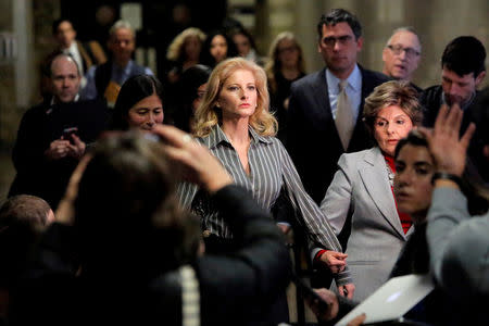 FILE PHOTO: Summer Zervos, a former contestant on The Apprentice, leaves New York State Supreme Court with attorney Gloria Allred, after a hearing on the defamation case against U.S. President Donald Trump in Manhattan, New York City, U.S., December 5, 2017. REUTERS/Andrew Kelly/File Photo