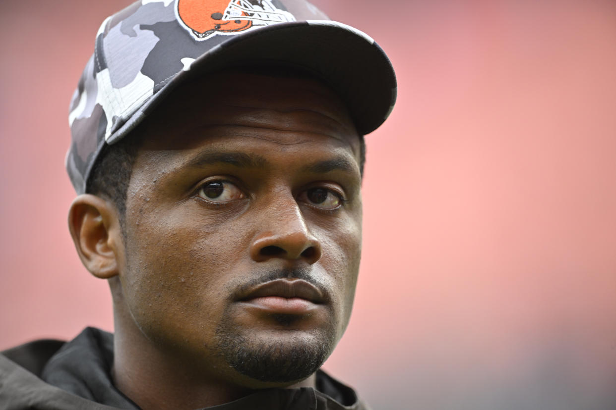 Cleveland Browns quarterback Deshaun Watson walks on the field after an NFL preseason football game against the Philadelphia Eagles in Cleveland, Sunday, Aug. 21, 2022. The Eagles won 21-20. (AP Photo/David Richard)