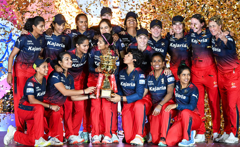 Royal Challengers Bangalore players, pictured here celebrating with the WPL trophy.