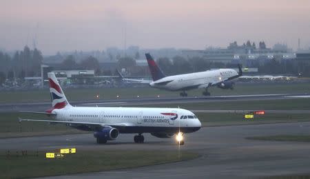 A British Airways aircraft taxis in the early morning at Heathrow airport in west London, Britain October 25, 2016. REUTERS/Eddie Keogh