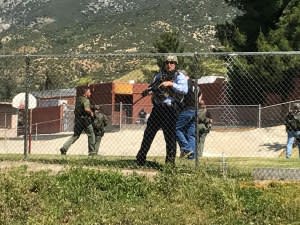 Emergency personnel respond to a shooting inside North Park Elementary School in San Bernardino, California, on Monday.