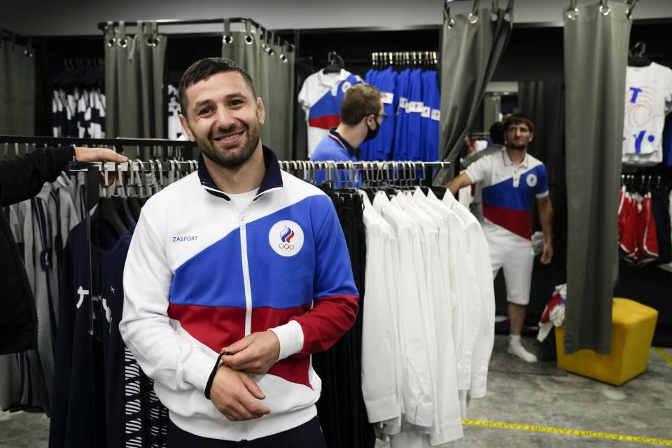 Russian athletes try on the new Olympic sportswear for the Tokyo Games by the brand ZASPORT in Moscow, Russia, Thursday, July 1, 2021. (AP Photo/Alexander Zemlianichenko)