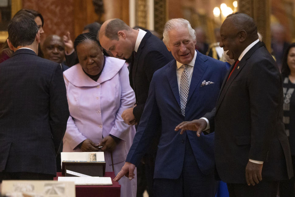 Britain's King Charles III, second right, and President Cyril Ramaphosa of South Africa, right, view a display of South African items from the Royal Collection at Buckingham Palace, London, Tuesday Nov. 22, 2022, during the two day state visit to the UK by the South African president. (Dan Kitwood/Pool via AP)