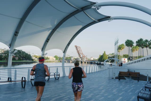 <p>James Jackman</p> Joggers on Tampa’s Riverwalk.