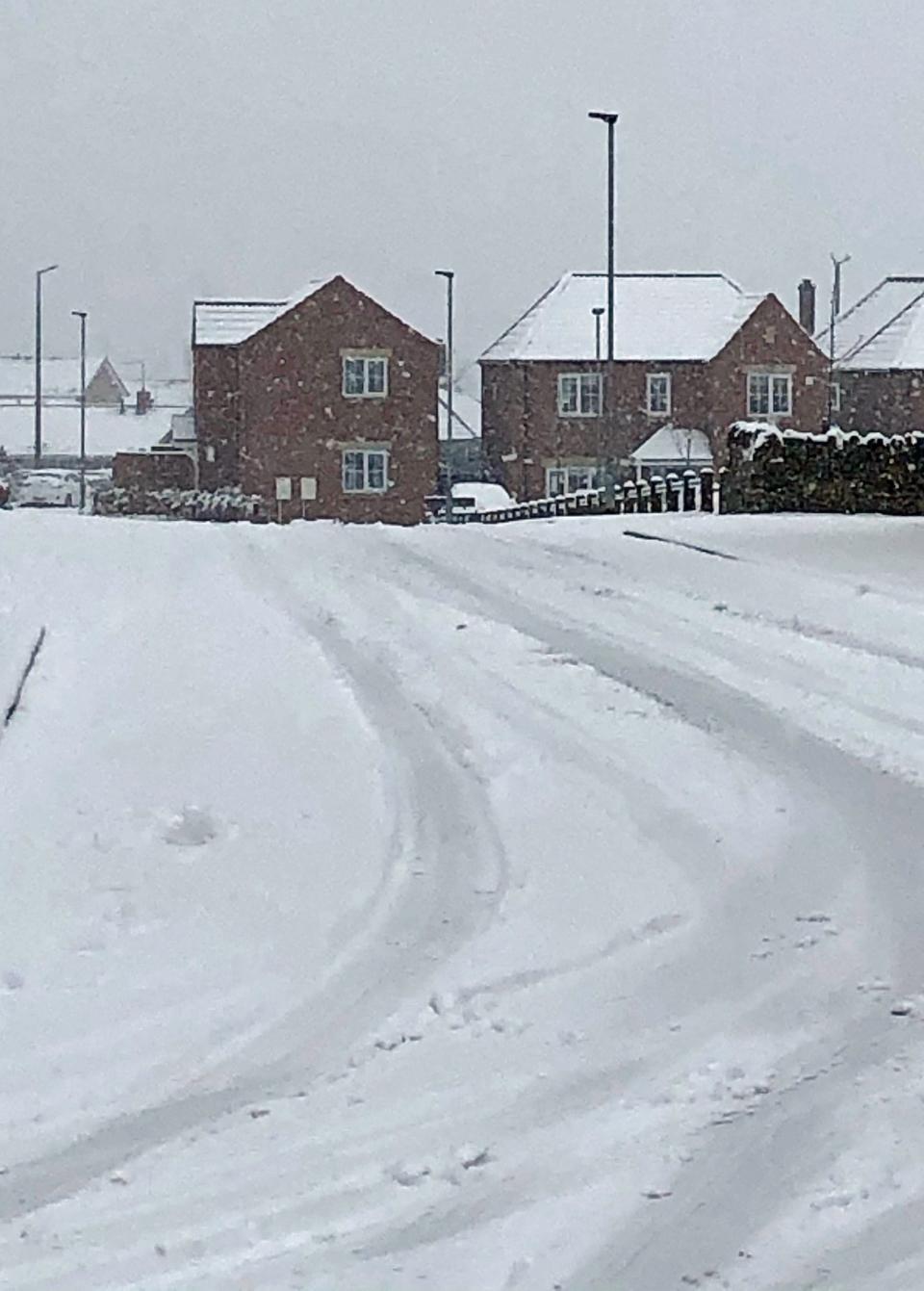 Snow covers a road in Monk Bretton, Barnsley, South YorkshirePA