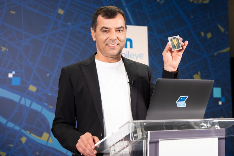 Handout image of Mobileye CEO Amnon Shashua holding a lidar chip being developed by the self-driving car firm