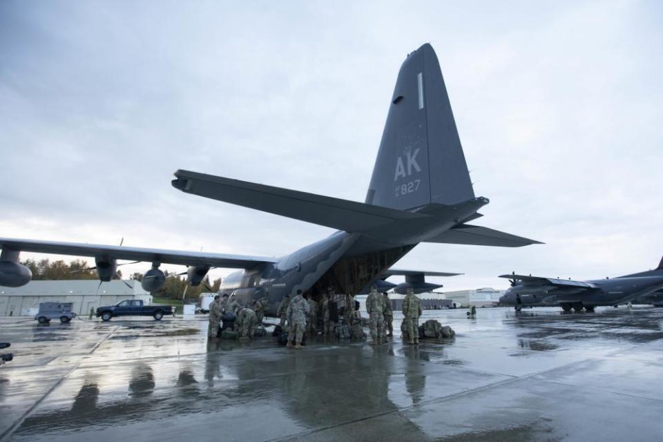 In this photo provided by the Alaska National Guard, members of the Alaska Army National Guard load their luggage aboard an HC130 Combat King II aircraft at Joint Base Elemendorf-Richardson, Alaska, Wednesday, Sept. 21, 2022. Approximately 100 members of the Alaska Organized Militia, comprised of the Alaska National Guard, Alaska State Defense Force and Alaska Naval Militia, were activated following a disaster declaration issued Sept. 17 after remnants of Typhoon Merbok caused flooding across more than 1,000 miles of the Alaskan coastline. (Victoria Granado/U.S. Army National Guard via AP)