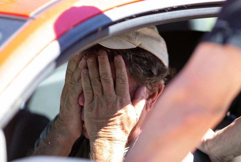 Billy Dutko, 67, left, is consoled by Mike Romeo, 53, in their neighborhood of St. Jude Harbors in Pine Island on Friday, Sept. 30, 2022, in Saint James City, Fla. Hurricane Ian made landfall on the coast of South West Florida as a category 4 storm Tuesday afternoon leaving areas affected with flooded streets, downed trees and scattered debris.