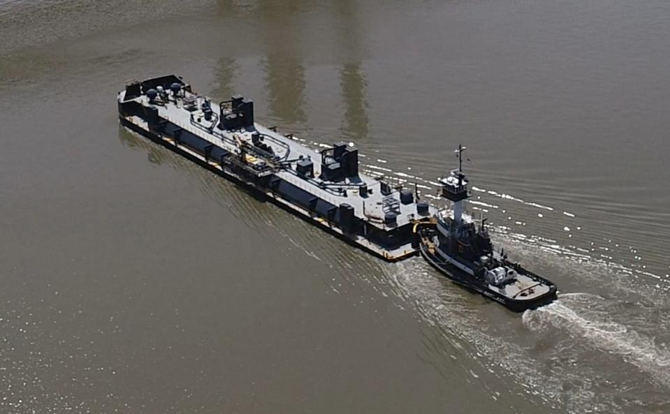 The tugboat Treasure Coast pushes a barge down the Hudson River near the Gov. Mario Cuomo Bridge April 9, 2024.