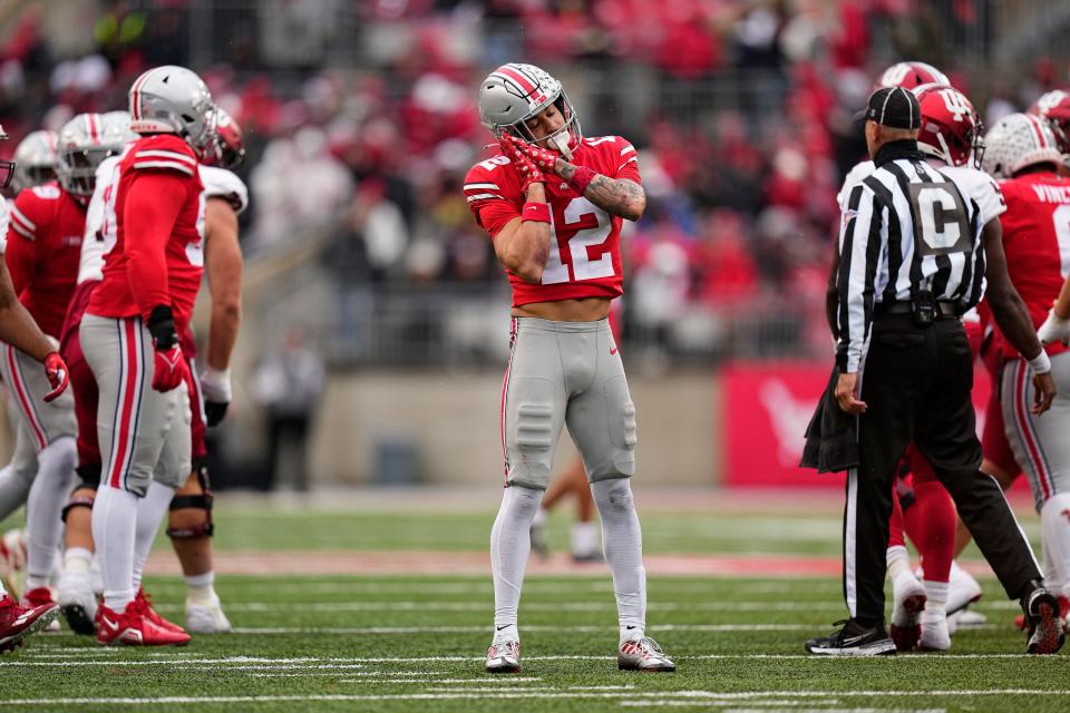 Ohio State safety Lathan Ransom celebrates a sack of Indiana's Dexter Williams II.