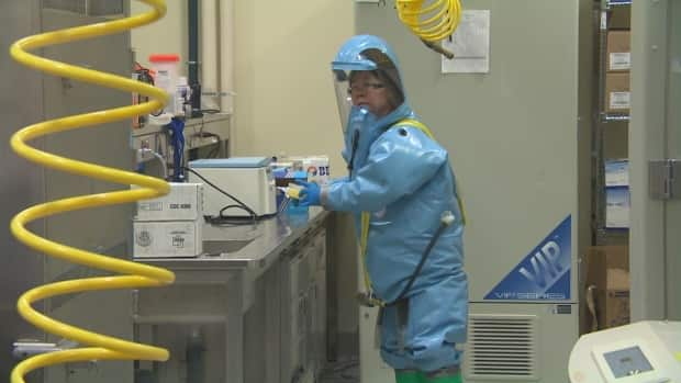 Xiangguo Qiu was escorted out of the National Microbiology Lab in Winnipeg in July 2019 along with her husband, Keding Cheng, months after the Public Health Agency of Canada reported a 'policy breach' at the lab to the RCMP. The two virologists were fired in January 2021. The RCMP is still investigating, and the reasons behind the firing remain a mystery to the public. (CBC - image credit)