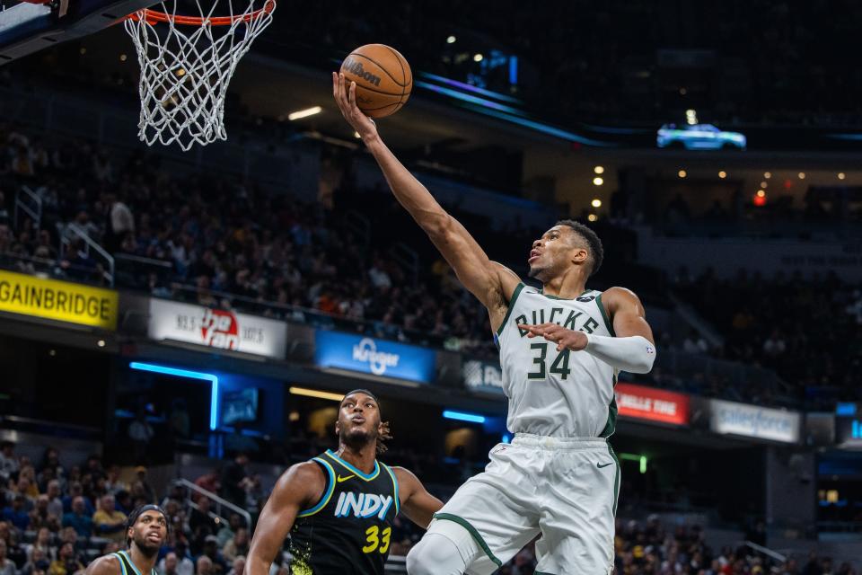 Bucks forward Giannis Antetokounmpo goes up for two of his game-high 34 points against the Pacers during the first half Thursday night.