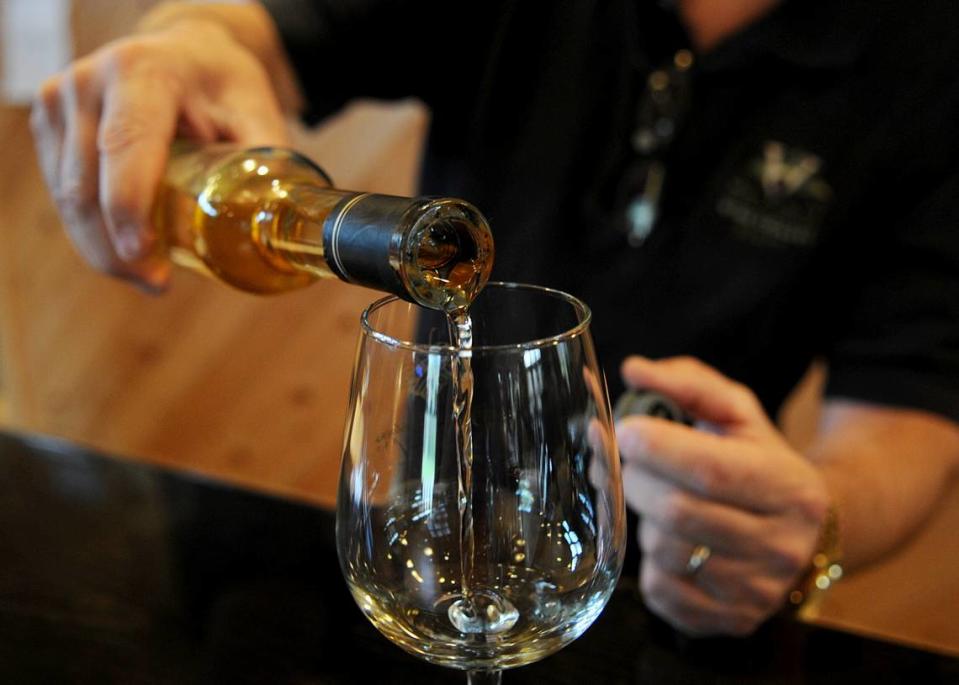 Wine maker and owner of Seven Mountains Wine Cellars Scott Bubb pours a glass of Vidal Ice Wine in the tasting room of the winery in Spring Mills.