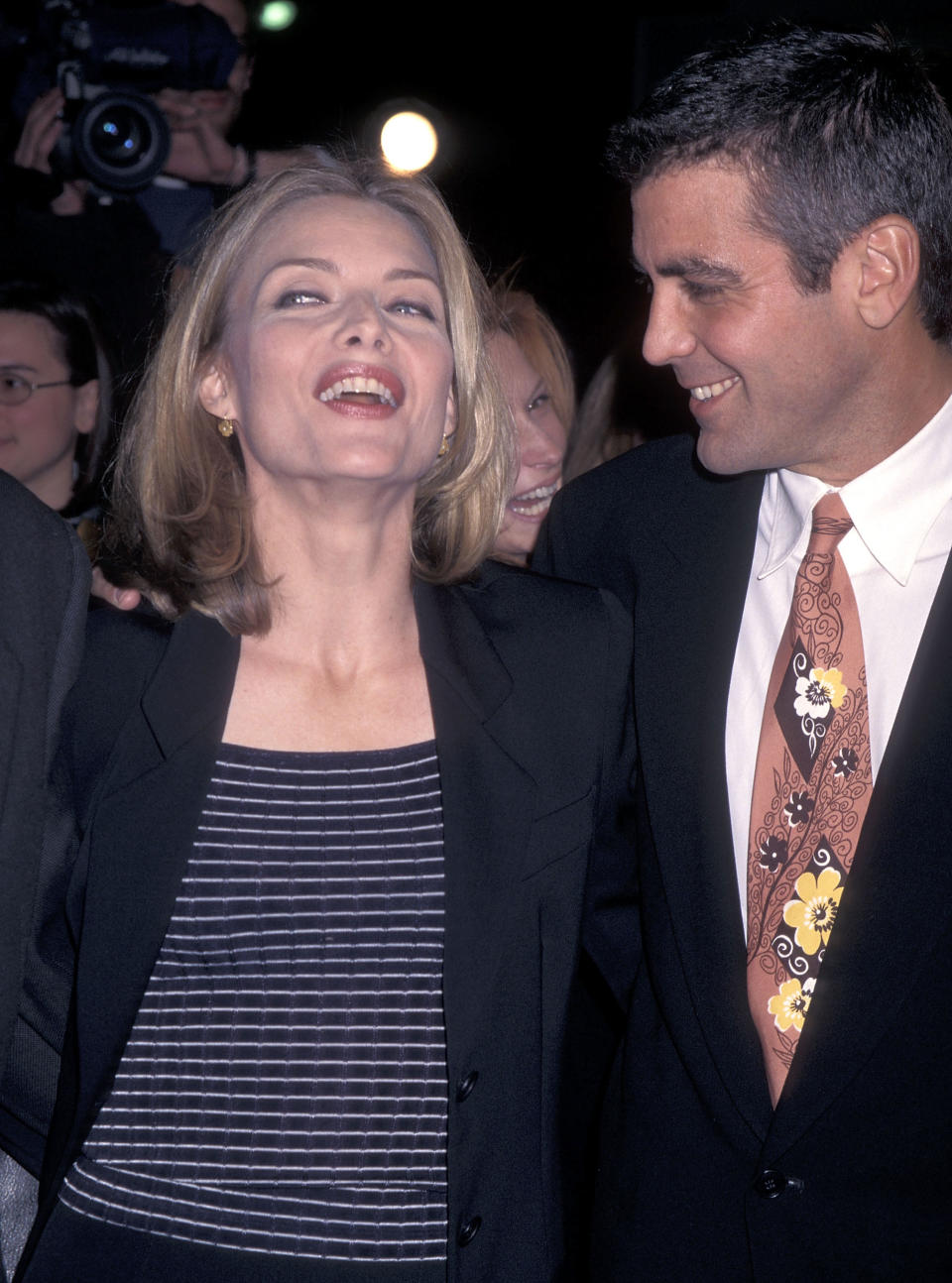 WESTWOOD, CA - DECEMBER 17:   Actress Michelle Pfeiffer and actor George Clooney attend the "One Fine Day" Westwood Premiere on December 17, 1996 at Mann's Chinese Theatre in Westwood, California. (Photo by Ron Galella, Ltd./Ron Galella Collection via Getty Images) 