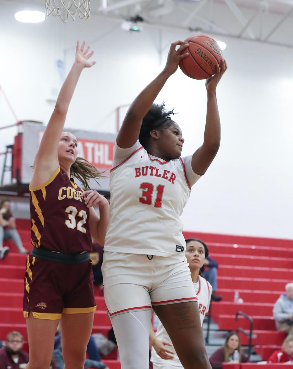 Butler's Ramiya White grabs a rebound against Cooper's Liz Freihofer. White, a Kentucky commit, scored six points Tuesday night.