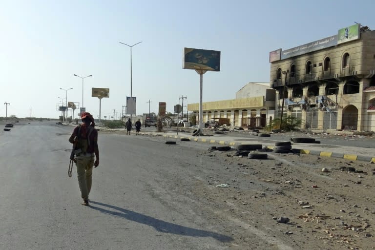 A Yemeni pro-government fighter walks in the rebel-held port city of Hodeida on December 15, 2018