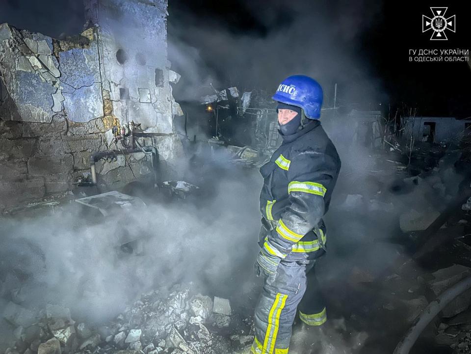 A firefighter works at a site of residential buildings heavily damaged during a Russian drone strike, amid Russia's attack on Ukraine, in Odesa, Ukraine (via REUTERS)
