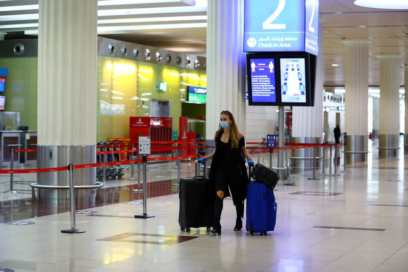 FILE PHOTO: Dubai International airport resumed limited outbound passenger flights amid outbreak of the coronavirus