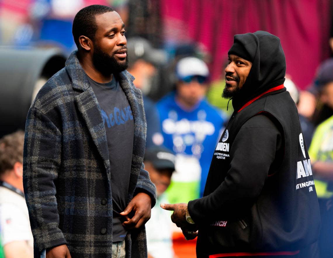 Former Seahawks Kam Chancellor and Marshawn Lynch talk before the NFL game between the Seattle Seahawks and the Denver Broncos at Lumen Field, on Sunday, Sept. 8, 2024, in Seattle.