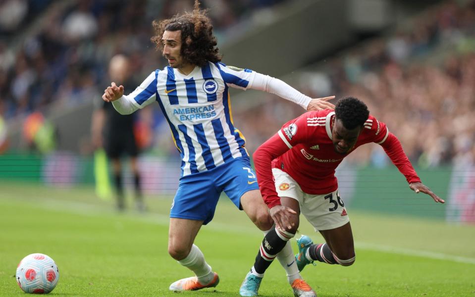 Marc Cucurella in action with Manchester United's Anthony Elanga - REUTERS