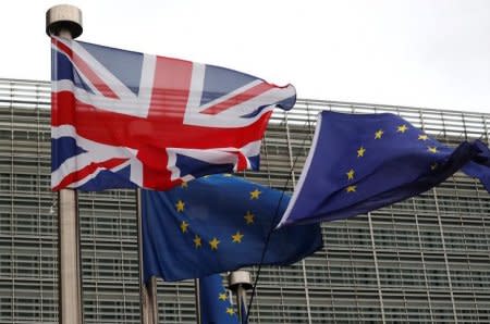 FILE PHOTO: The British flag flies next to European flags at the European Commission in Brussels, Belgium December 8, 2017. REUTERS/Yves Herman