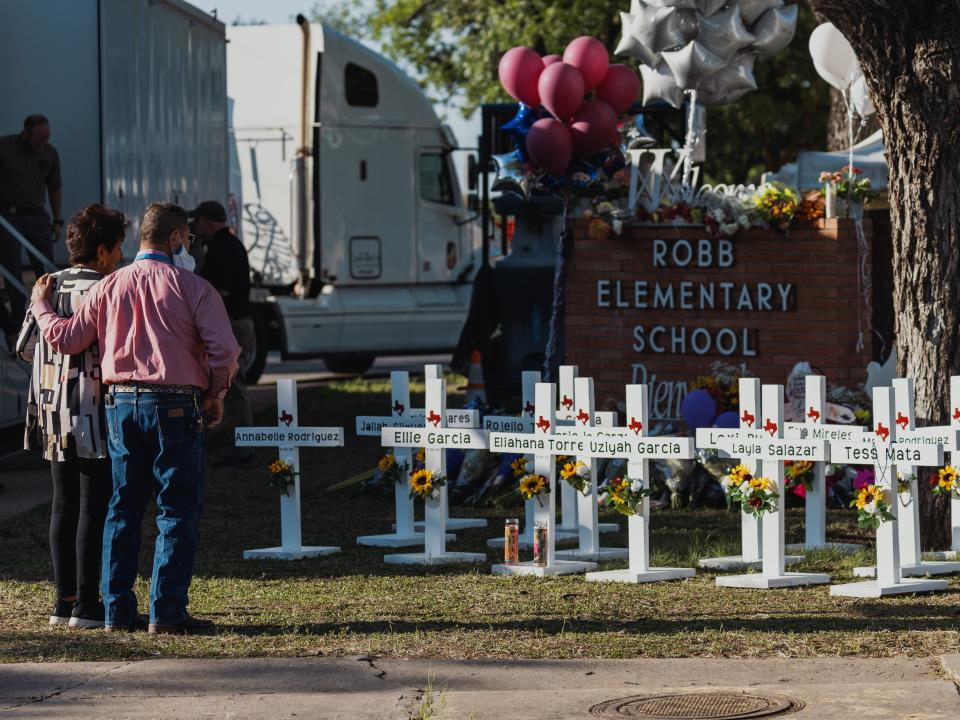 Crosses bearing the names of the victims of a mass shooting in front of Robb Elementary School on May 26, 2022 in Uvalde, Texas. The rural Texas community is in mourning following a shooting at Robb Elementary School which killed 21 people including 19 children.