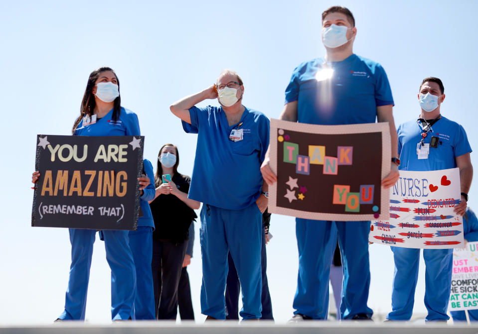 Hospital staff, including nurses, doctors and administrators, look on in anticipation in Dallas, Texas. (Photo: Getty)