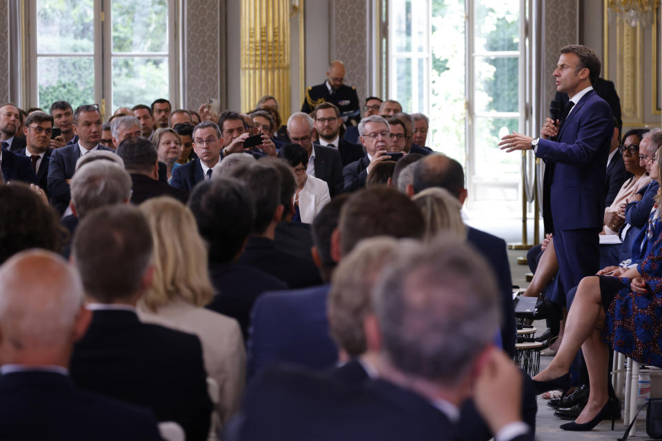 French President Emmanuel Macron addresses mayors of cities affected by the violent clashes that erupted after a teen was shot dead by police last week during a meeting at the presidential Elysee Palace in Paris Tuesday, July 4, 2023. After the death of a 17-year-old shot by police in a Paris suburb, French President Emmanuel Macron was meeting with mayors of 220 towns from across the country which were hit by violence. Across France, 34 buildings — many of them linked to the government — were attacked from Sunday into Monday, along with 297 vehicles. (Ludovic Marin, Pool via AP)