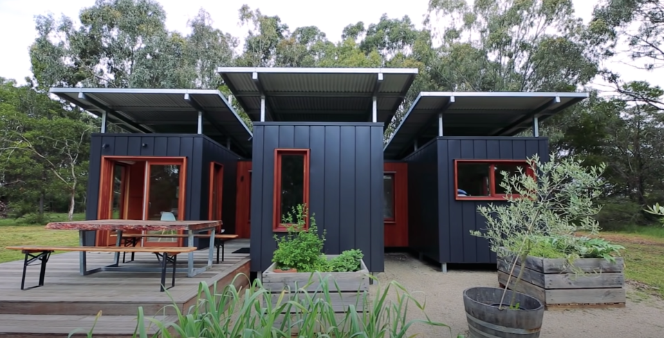 A very modern and sleek home made from three connected shipping containers