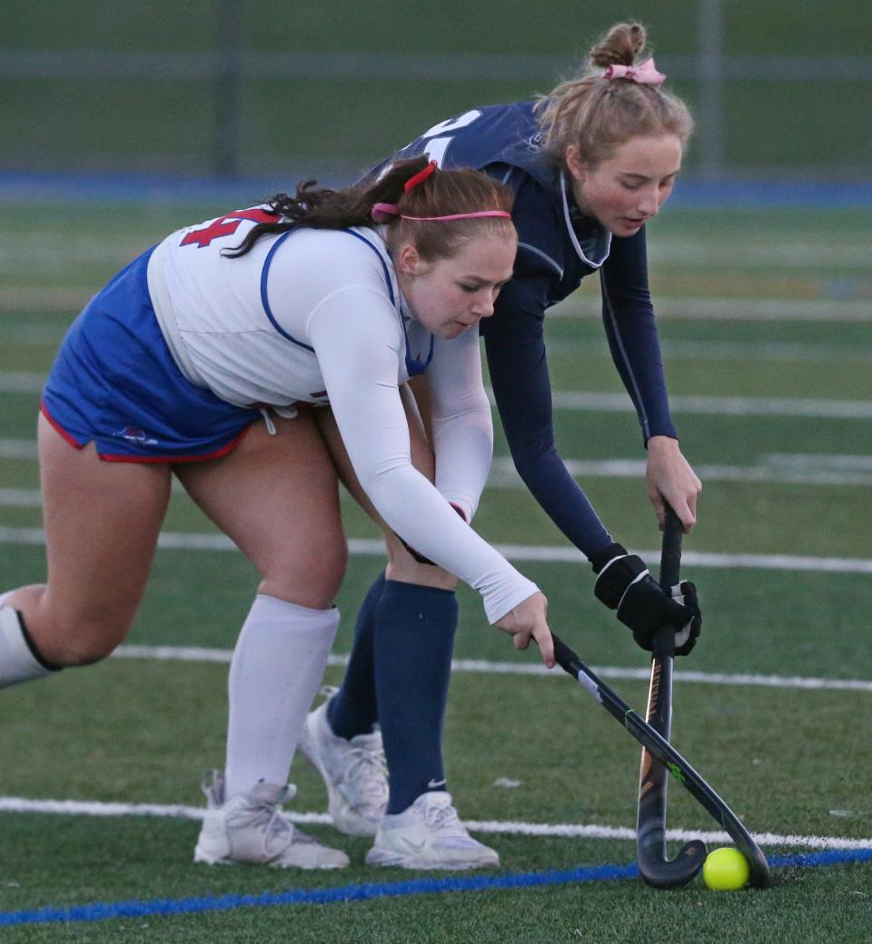 Brighton's Avery Coke (27), right, and Fairport's Taylor Frank (24), left, battle for control of the ball during their Section V Class A semifinal game Thursday, Oct. 27, 2022 at Fairport High School.